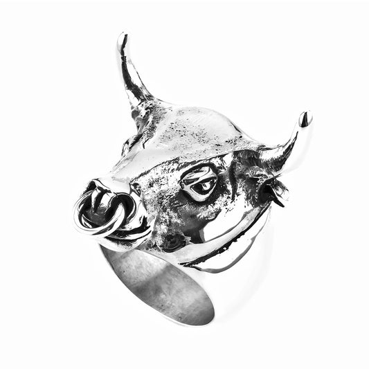 A silver ring featuring a stylized animal (bull) design on a white background.
