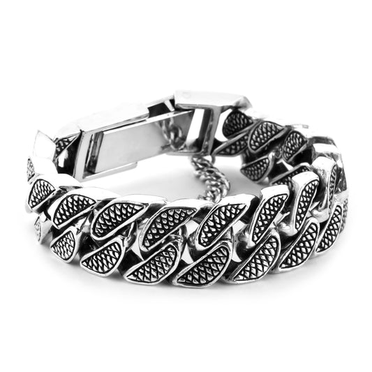 Engraved snake skin design on sterling silver handmade bracelet with a security chain. 
