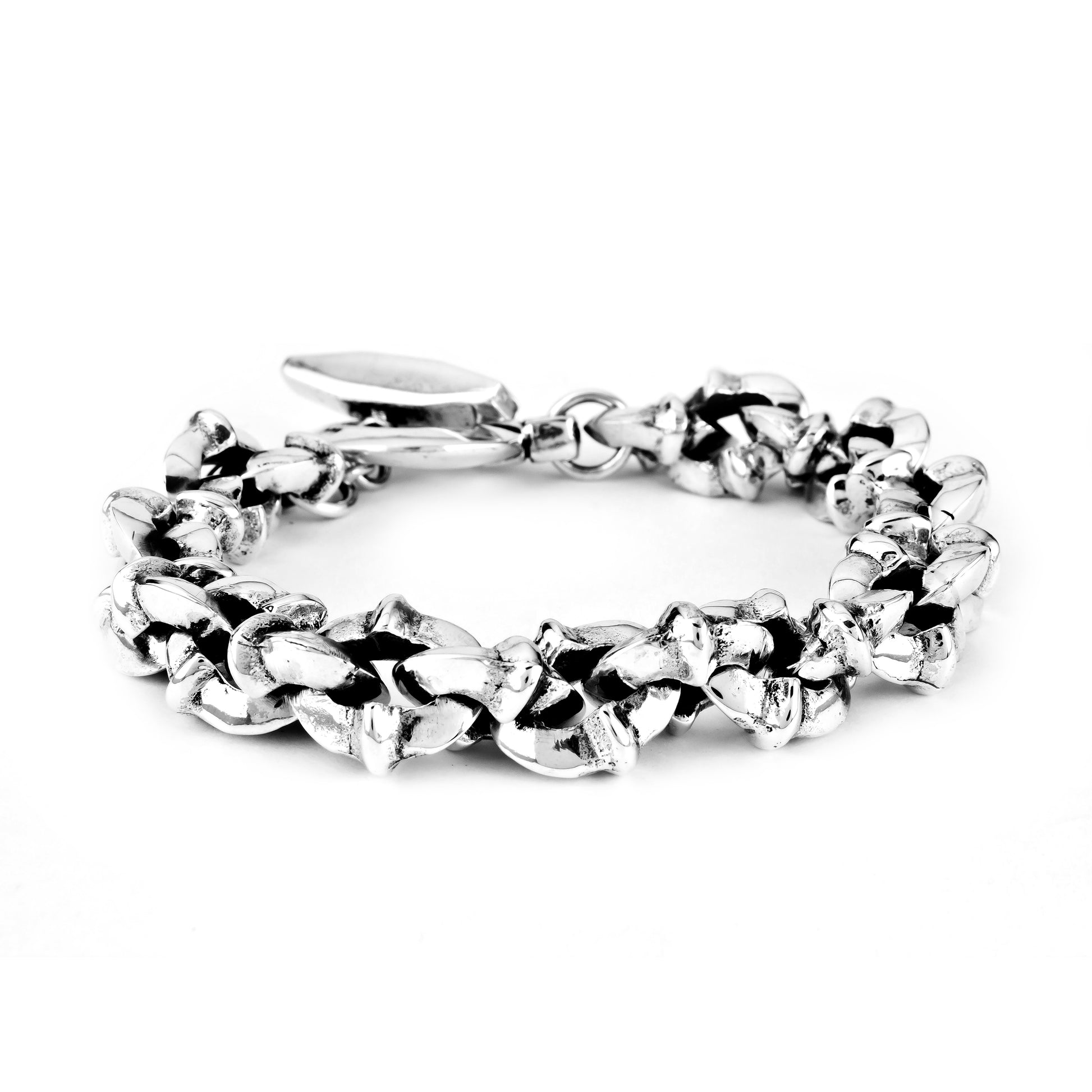 A silver chunky bracelet with a solid pattern, displayed on a neutral background.